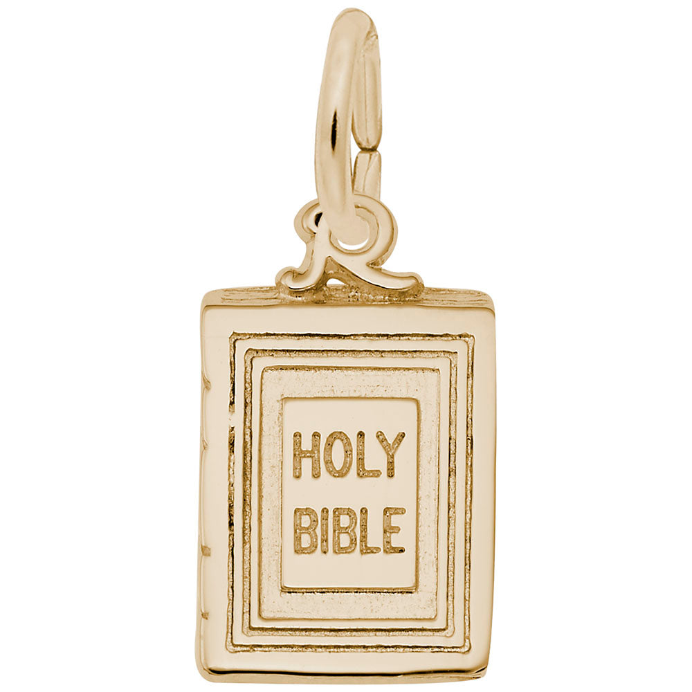 Gold 'Holy Bible' charm on a white background