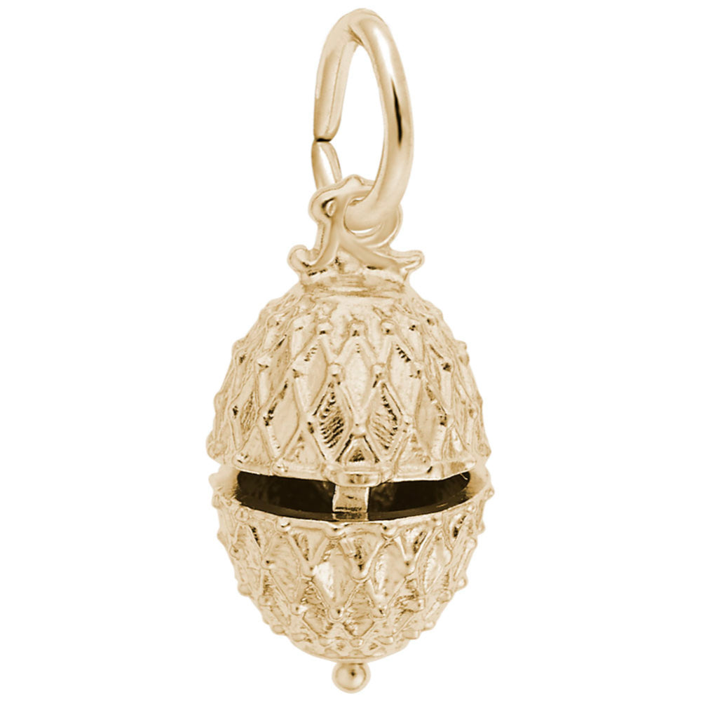 Gold pendant with intricate design on a white background