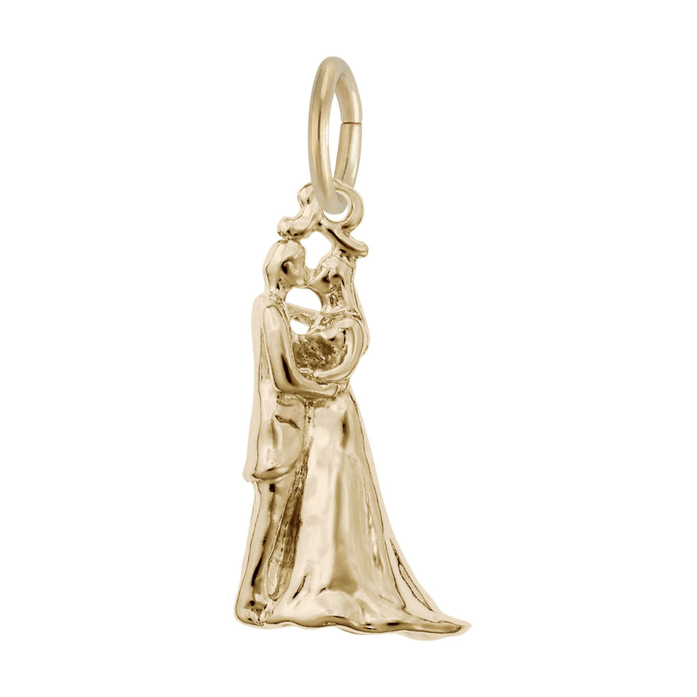 Gold charm depicting a bride anmd groom kissing, shown on a white background