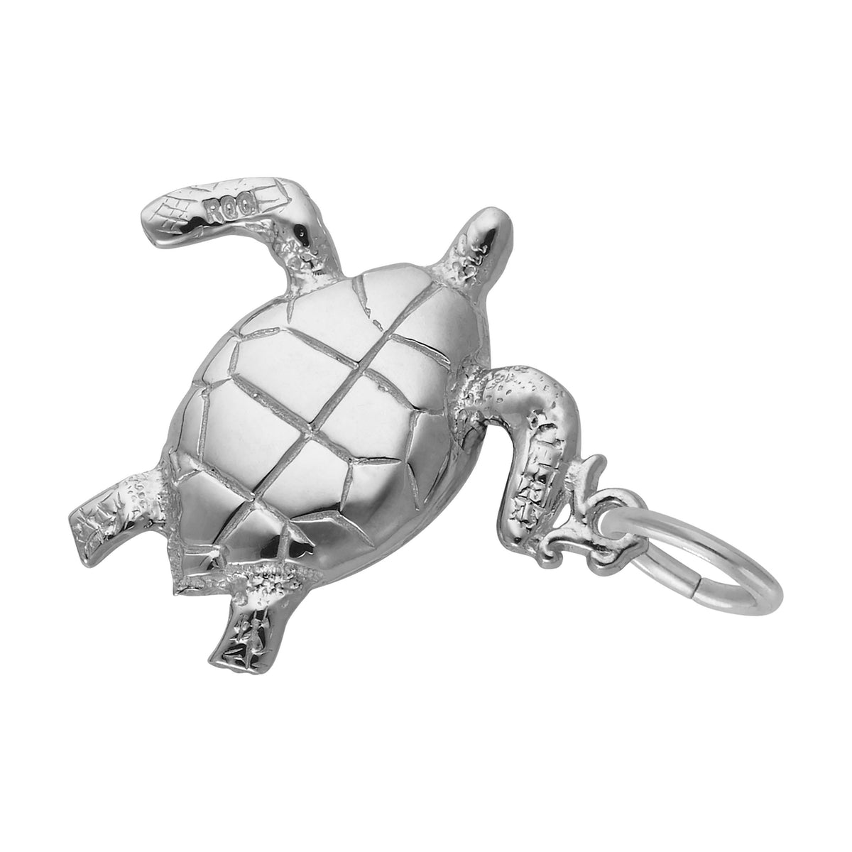 Bottom of a silver turtle charm with detailed shell, shown on a white background