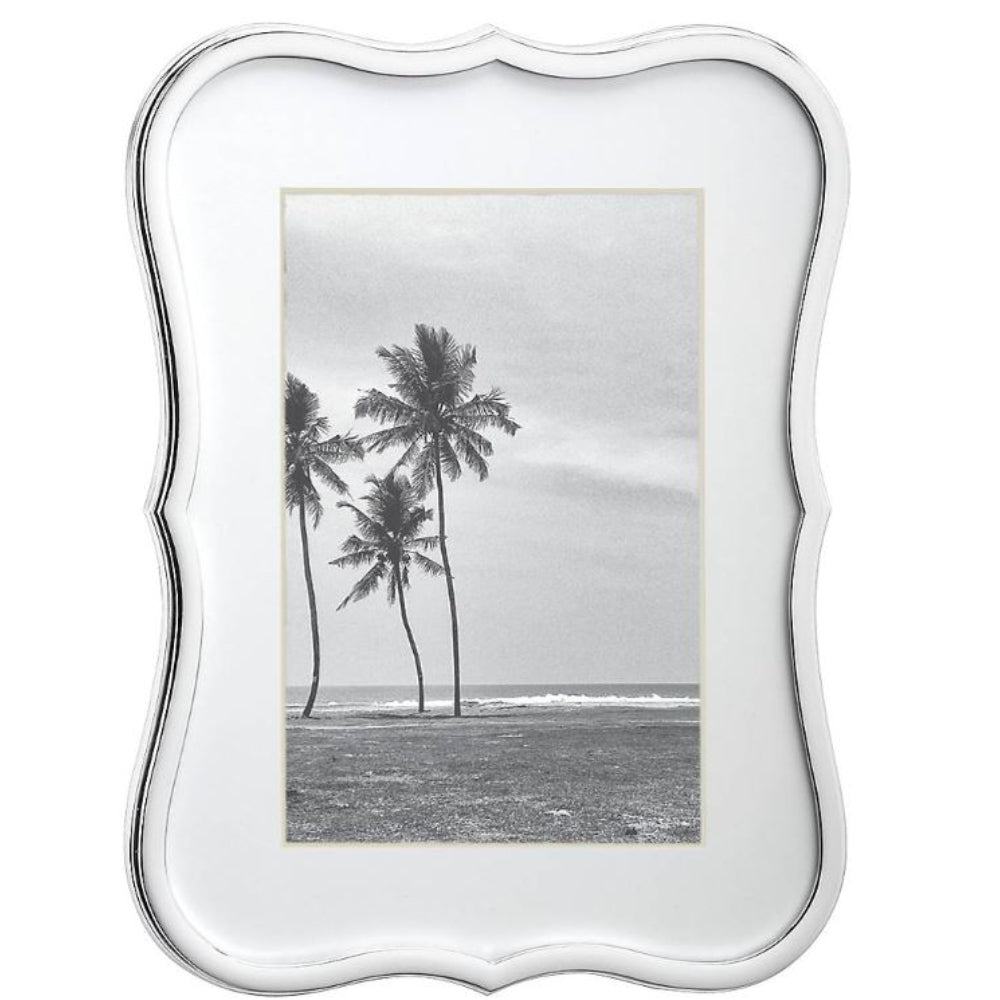 Silver 4x6 picture frame with curved edges with a beach scene of palm trees and ocean.