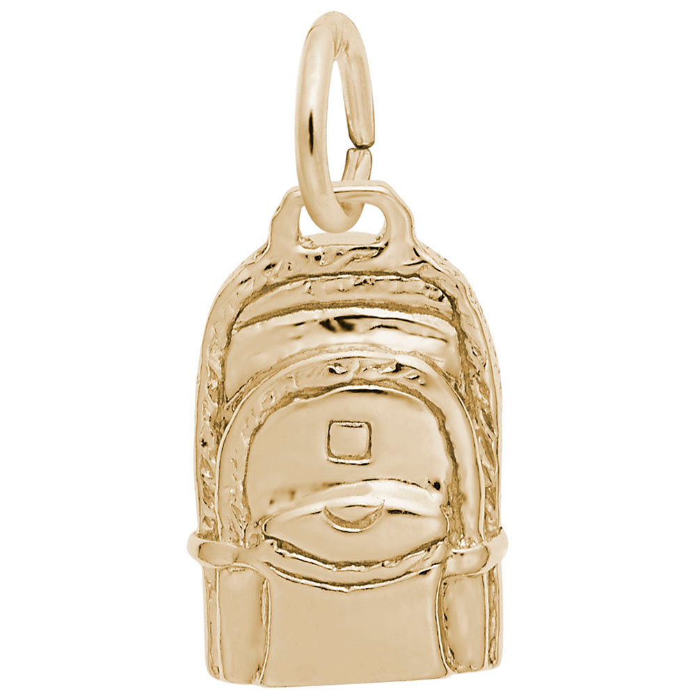 Gold backpack charm on a white background