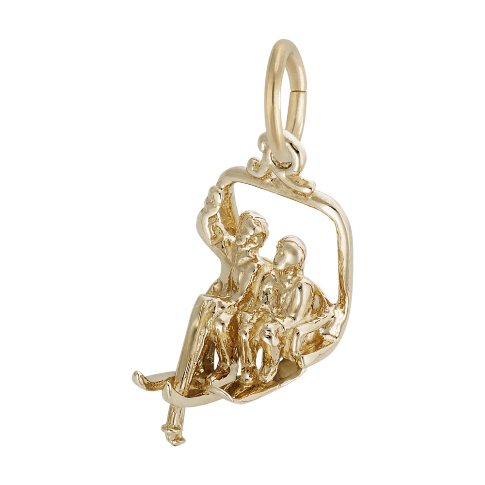 A gold charm pendant depicting two people sitting in a swing or gondola, shown on a plain white background.