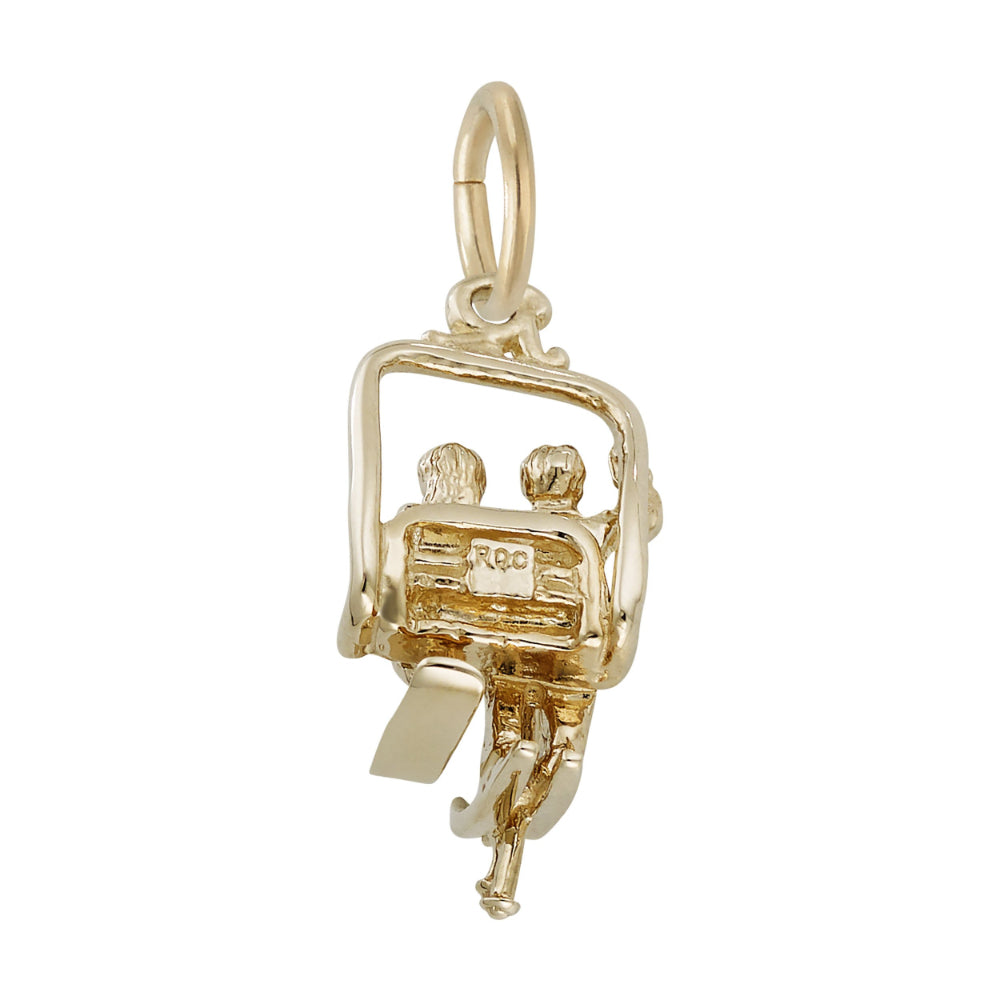 Back of A gold charm pendant depicting two people sitting in a swing or gondola, shown on a plain white background.
