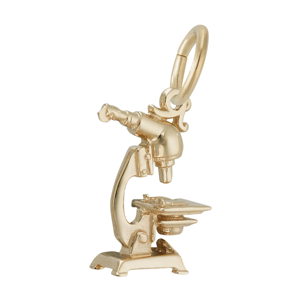 Opposite side of  a Gold microscope charm on a white background