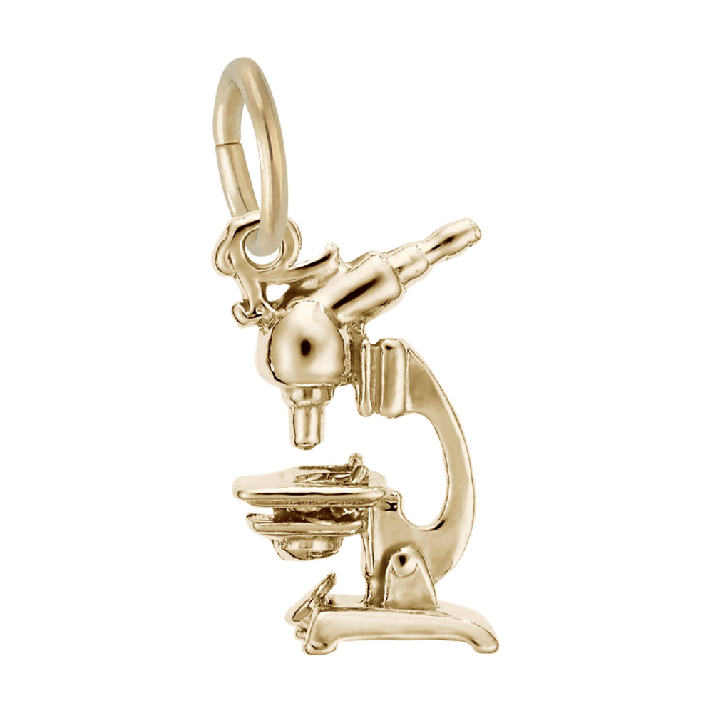 Gold microscope charm on a white background