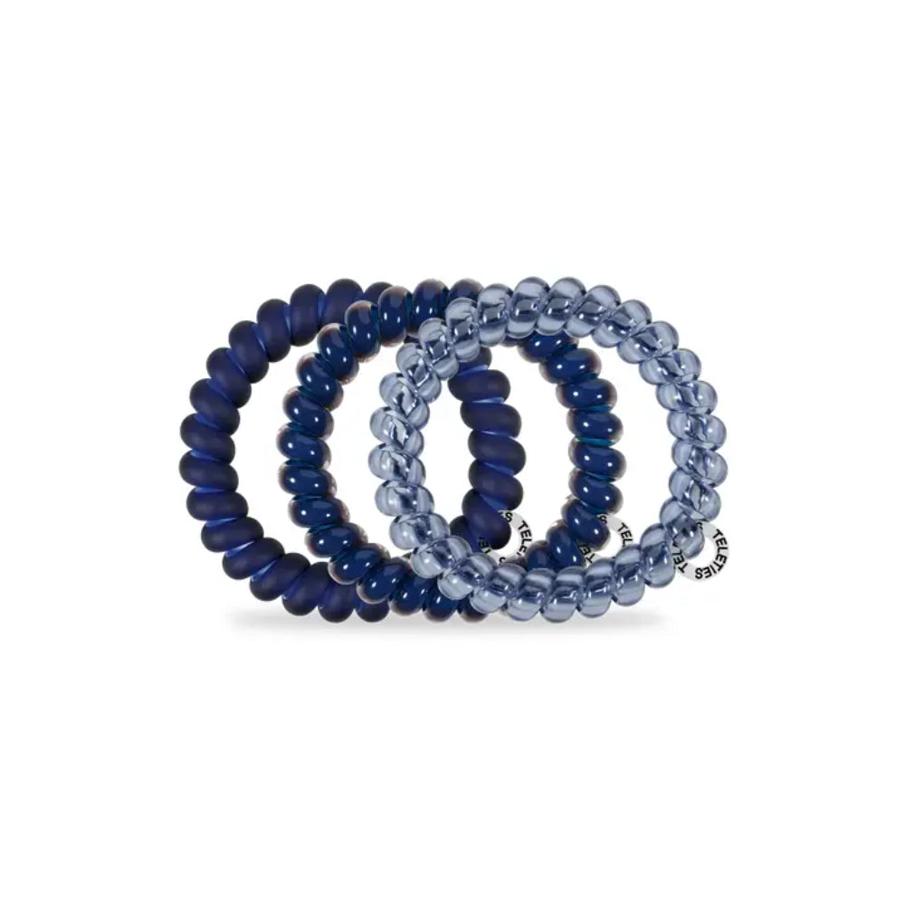 Set of blue beaded hair ties on a white background