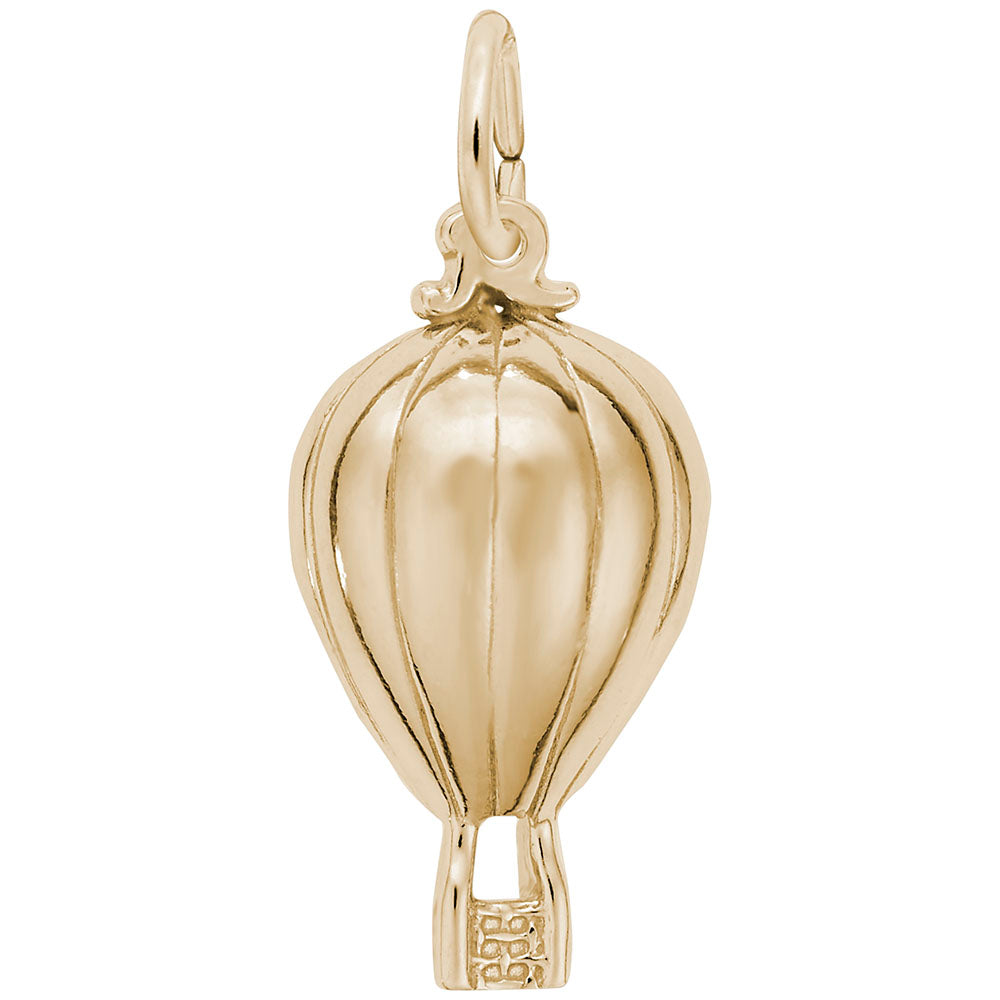 Gold hot air balloon charm on a white background