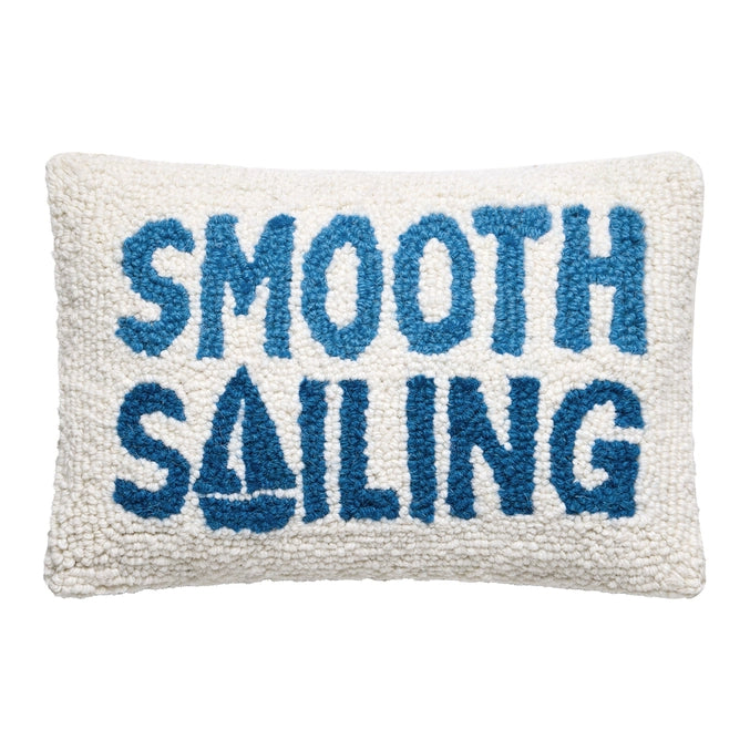 Pillow with 'Smooth Sailing' text in blue on a white background