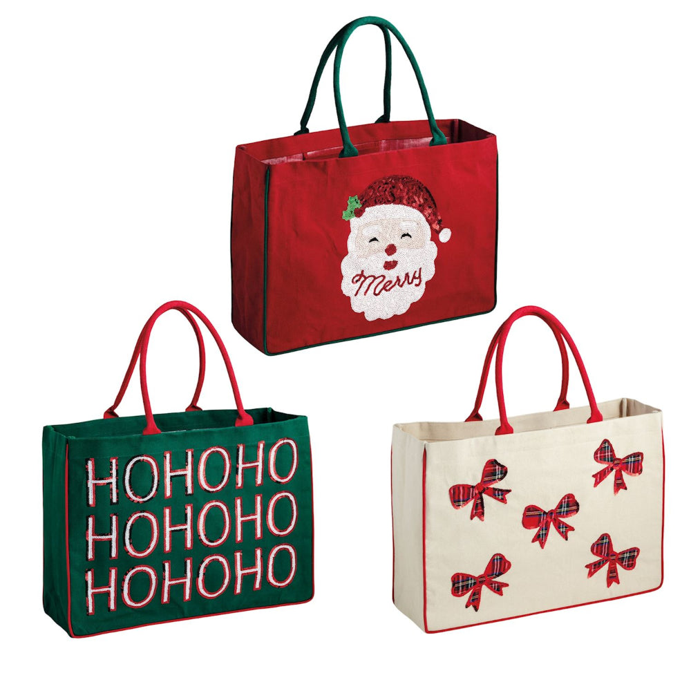 Three Christmas-themed tote bags with Santa face, 'HOHOHO' text, and bow designs on a white background.