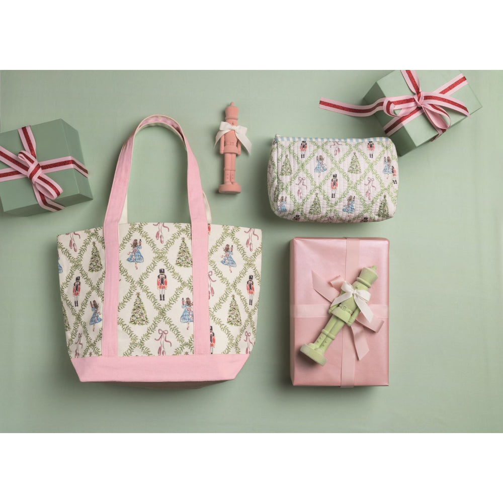 Patterned tote bag, small pouch, and gift boxes on a light green background