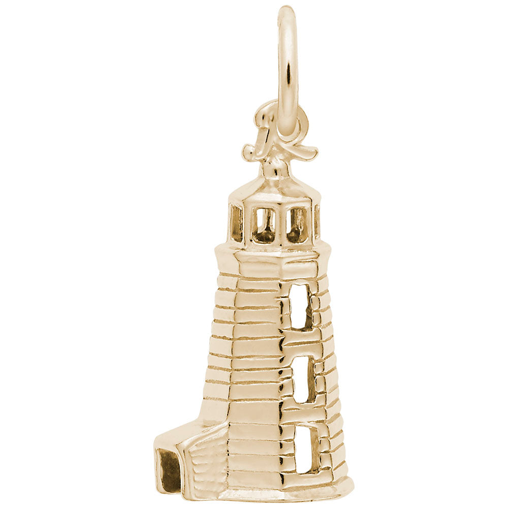 Gold lighthouse charm on a white background