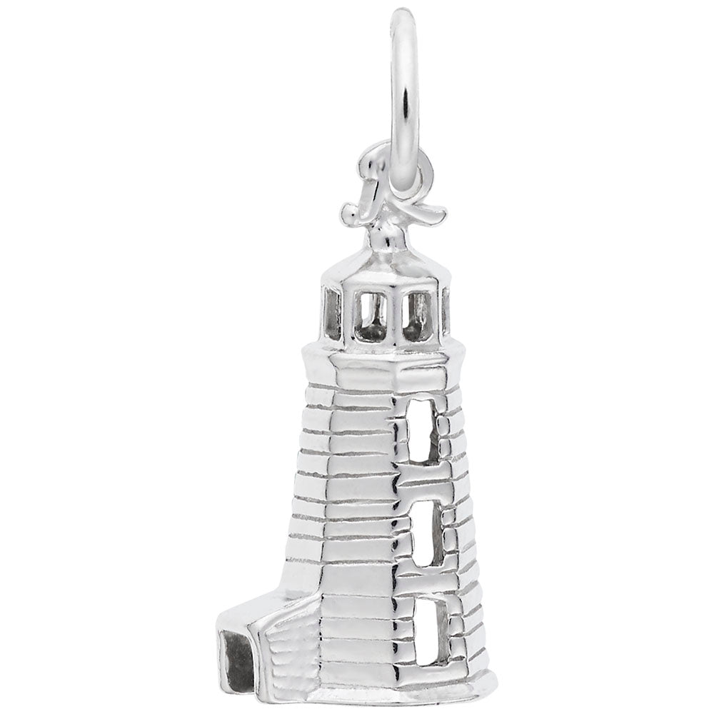 Silver lighthouse charm on a white background