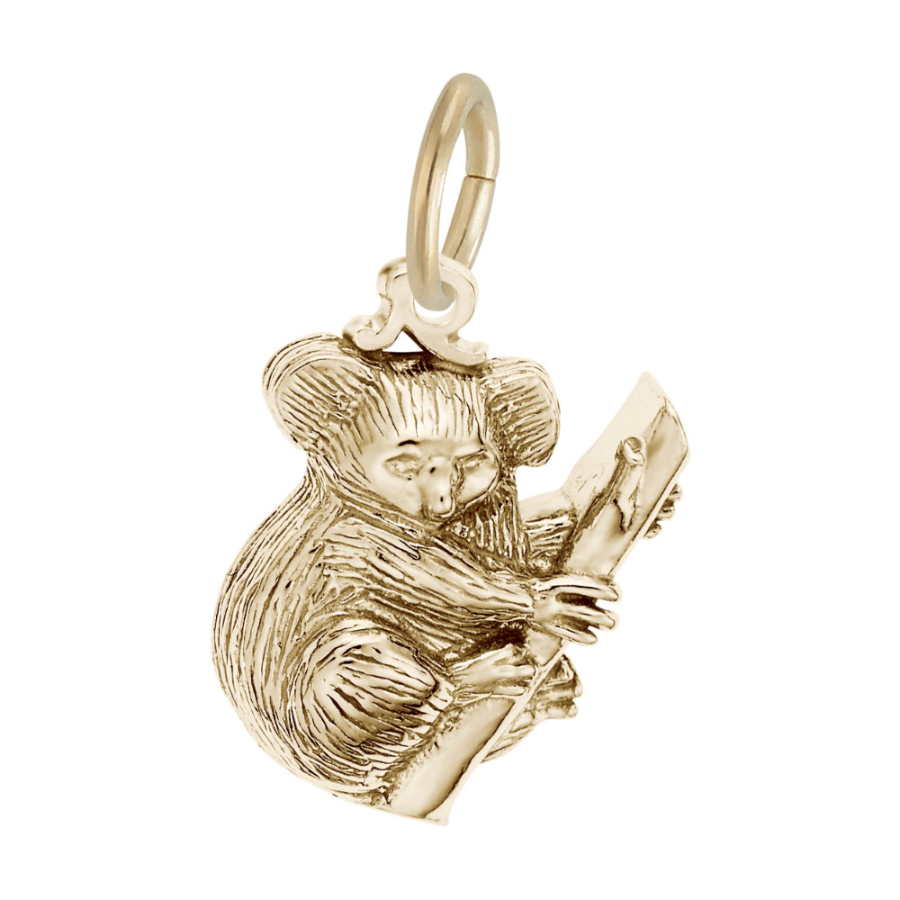 Gold koala bear charm holding a eucalyptus branch on a white background