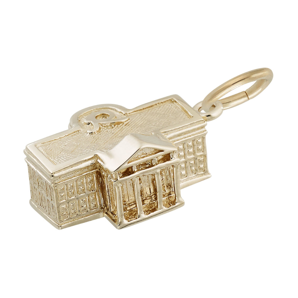 Angled view of a gold White House charm with intricate detailing, shown on a white background