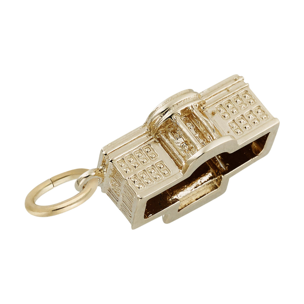 Back of a gold White House charm with intricate detailing, shown on a white background