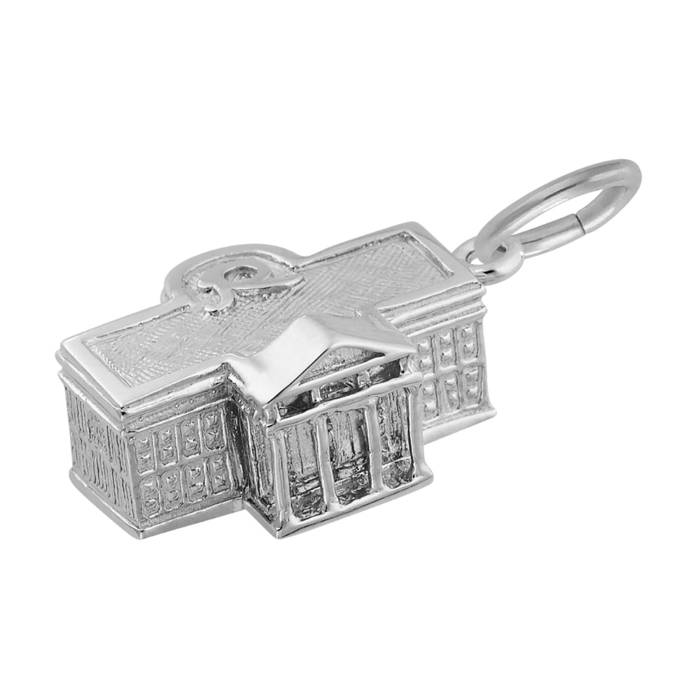 Angled view of a silver White House charm with intricate detailing, shown on a white background
