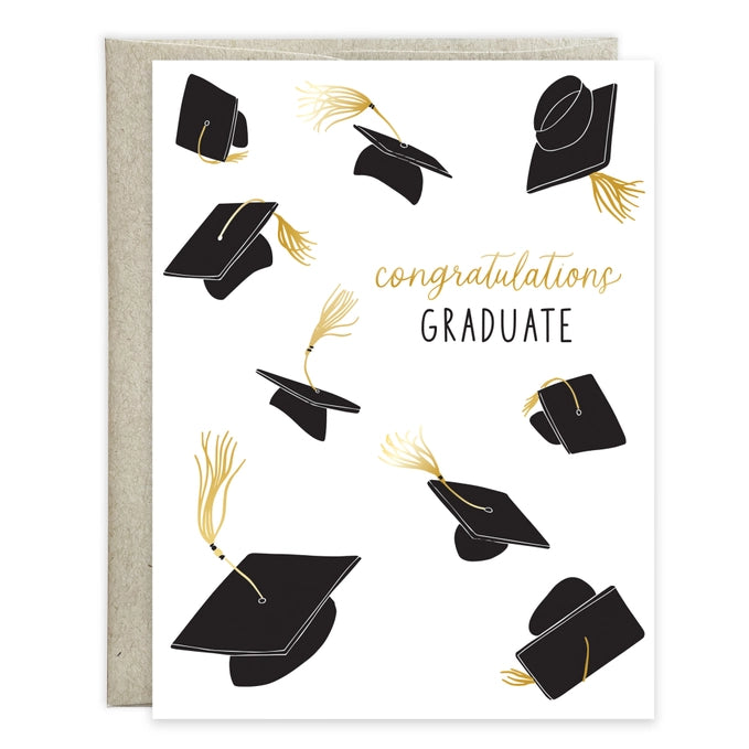 Graduation card with black caps and tassels on a white background