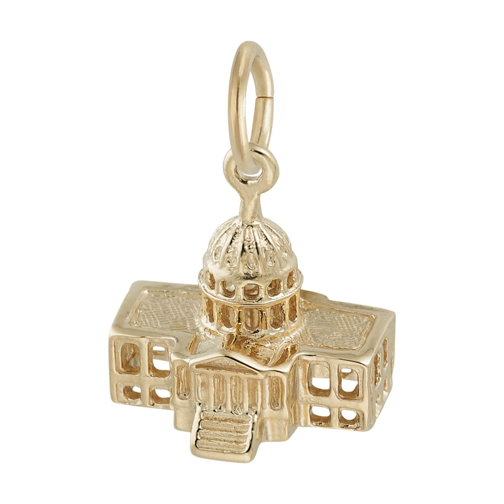 A gold charm shaped like the US Capitol building, featuring a detailed dome and surrounding structure, shown on a plain white background.
