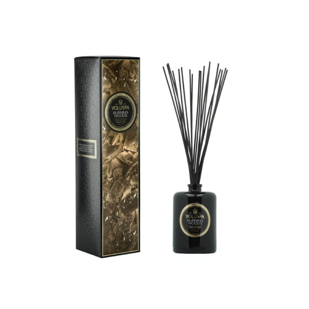 Black burning woods diffuser with box on a white backround. 