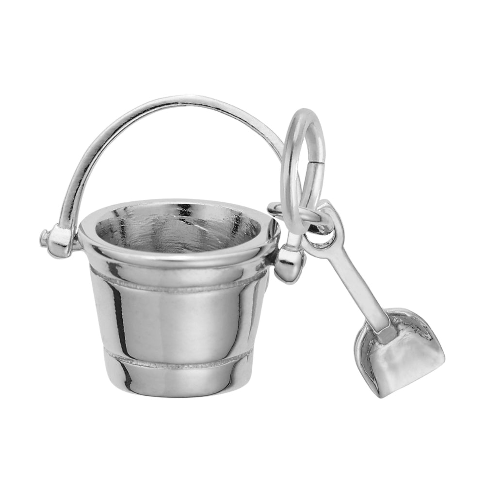 Silver bucket and shovel charm on a white background