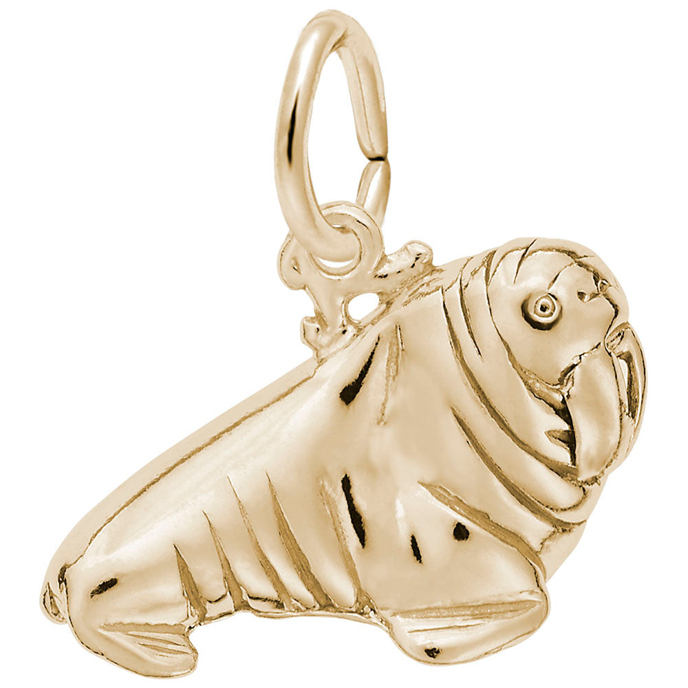 Detailed gold walrus charm on a white background