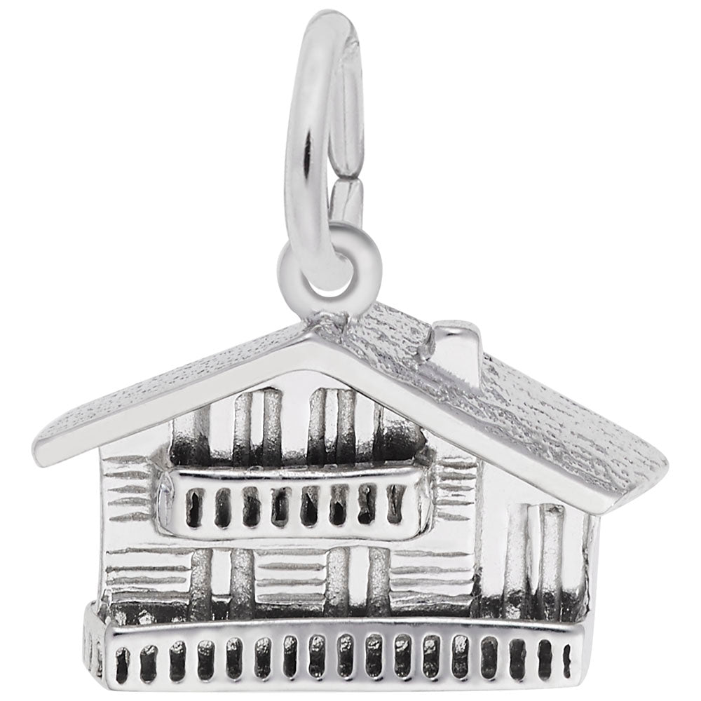 Silver Swiss Chalet shaped charm on a white background