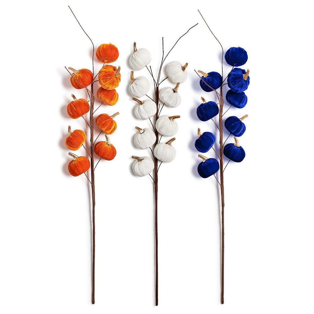 Three decorative autumn branches with faux pumpkins in orange, white, and royal blue, arranged vertically on a plain white background.