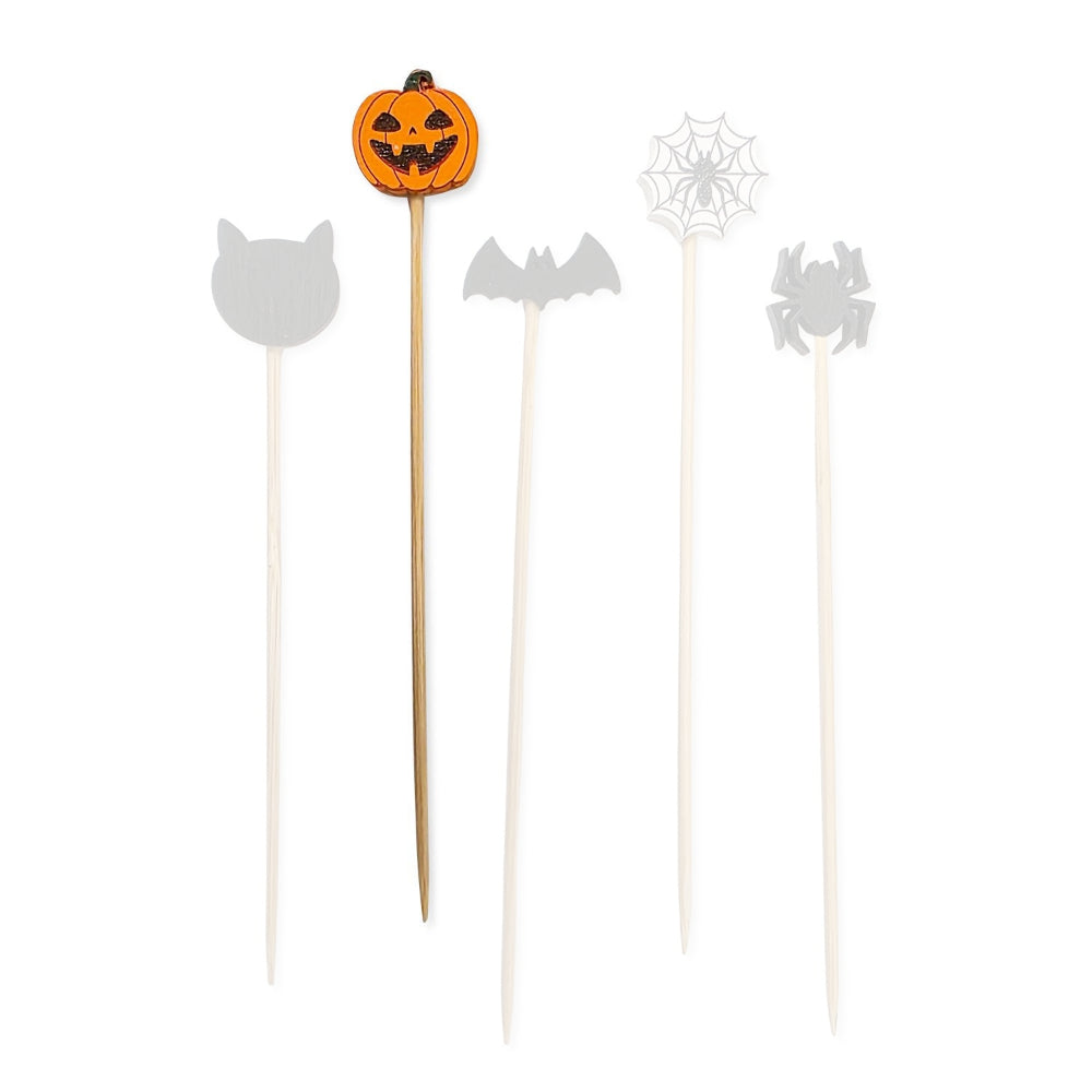 Orange pumpkin jack-o-lantern halloween-themed wooden cocktail pick with a jack-o-lantern design  a white backround.