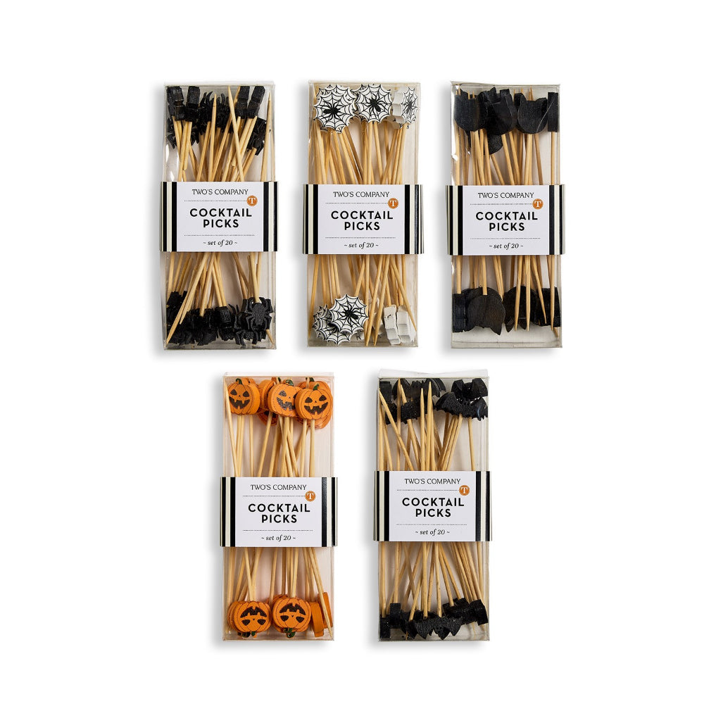 Five packages of Trick or Treat Cocktail Picks on a white background. The picks include black skull, spider, and bat motifs, silver and white glittery mushrooms, and orange jack-o'-lanterns.