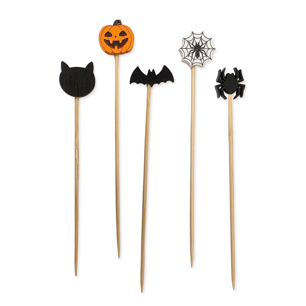 Halloween-themed toothpicks with cat, jack-o'-lantern, bat, spider, and web designs on a white background.