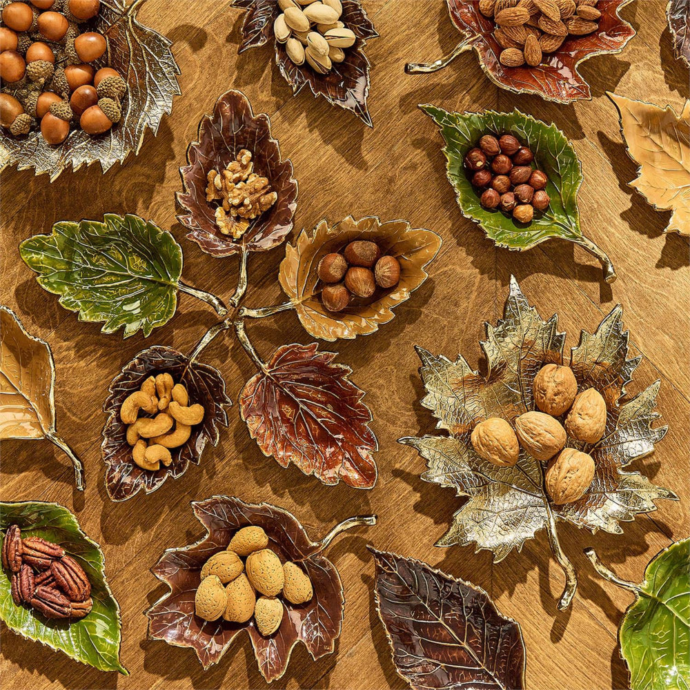Decorative arrangement of nuts and leaves on a wooden surface