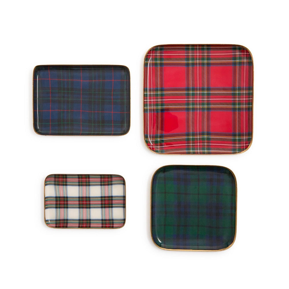 Four square plates with colorful tartan plaid patterns on a white background.