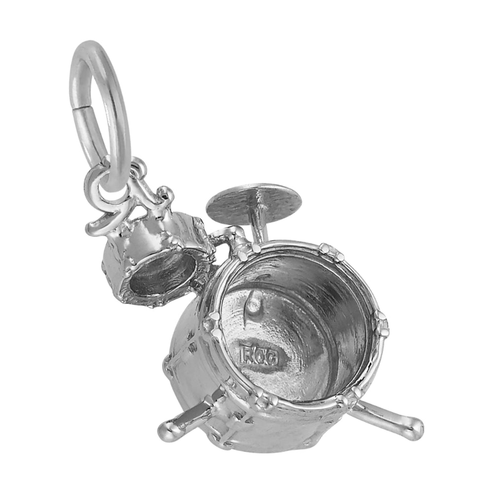 A silver drummer charm featuring a main bass drum, a smaller tom, and cymbal, shown on a plain white background.