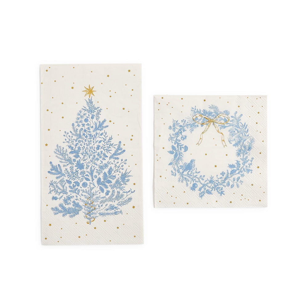 Decorative white christmas cocktail & dinner paper napkins with a blue tree with gold star and one with a blue wreath and gold bow on a white background.