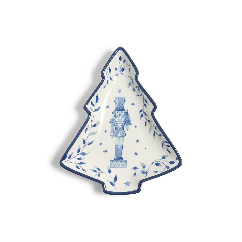 Tree-shaped ceramic plate with blue nutcracker design on a white background.
