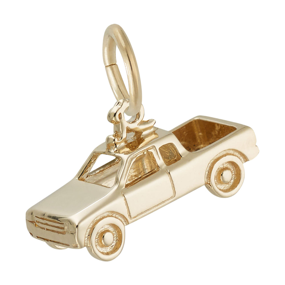 3/4 view of a gold truck shaped charm with detailed engraving, shown on a white background facing left
