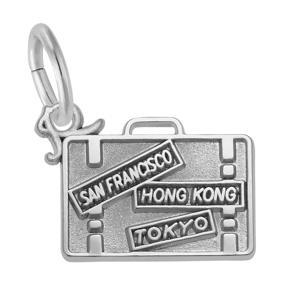 Silver charm shaped like a suitcase with 'San Francisco', 'Hong Kong', and 'Tokyo' text on a white background