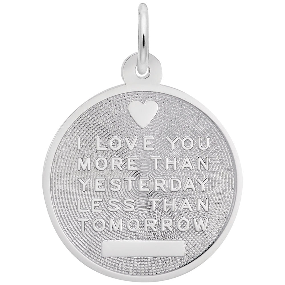 Silver textured disc charm with "I LOVE YOU MORE THAN YESTERDAY LESS THAN TOMORROW" TEXT, shown on a plain white background 