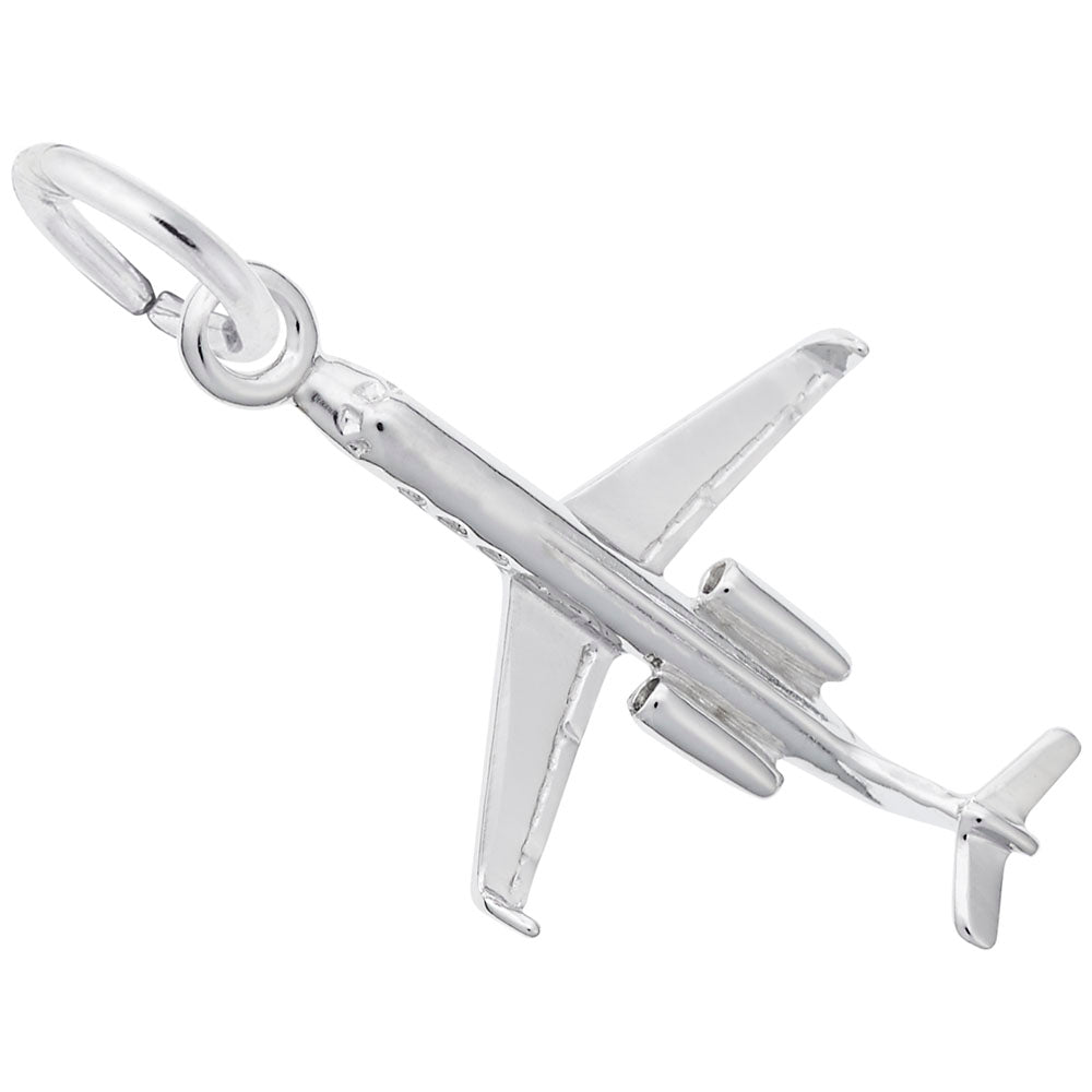 Silver airplane charm on a white background