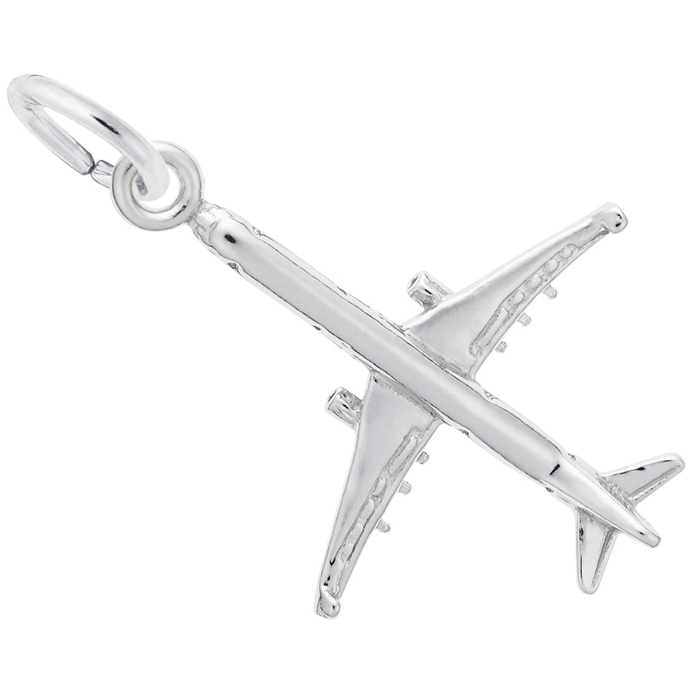 Silver airplane charm on a white background