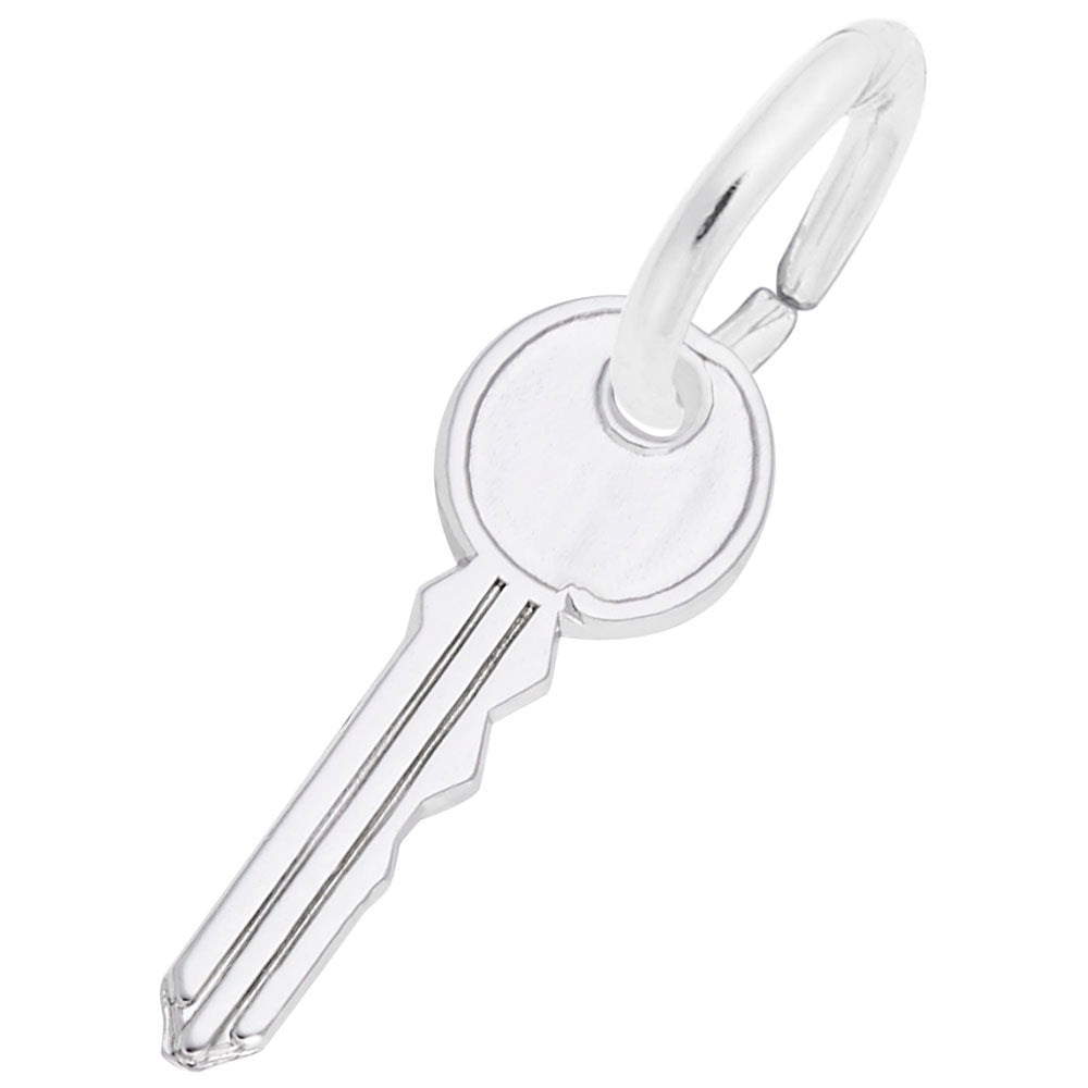 Silver house key-shaped charm on a white background