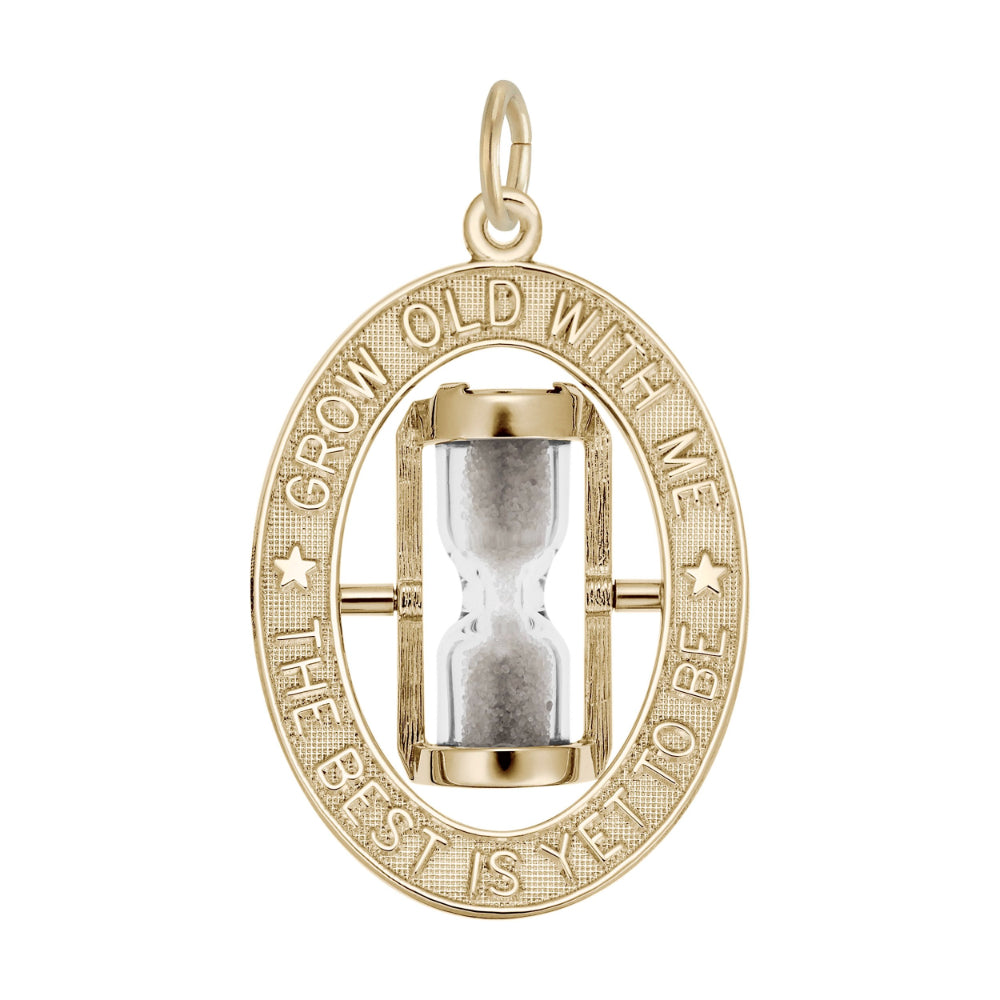A gold oval charm featuring an hourglass in the center, surrounded by a textured border with the engraved text 'GROW OLD WITH ME THE BEST IS YET TO BE'.