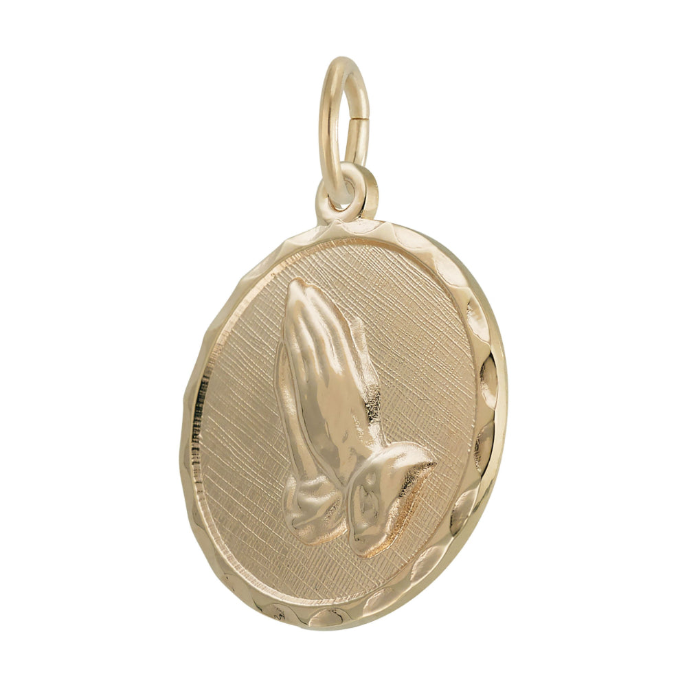 Gold disc charm engraved with praying hands  shown on a white background