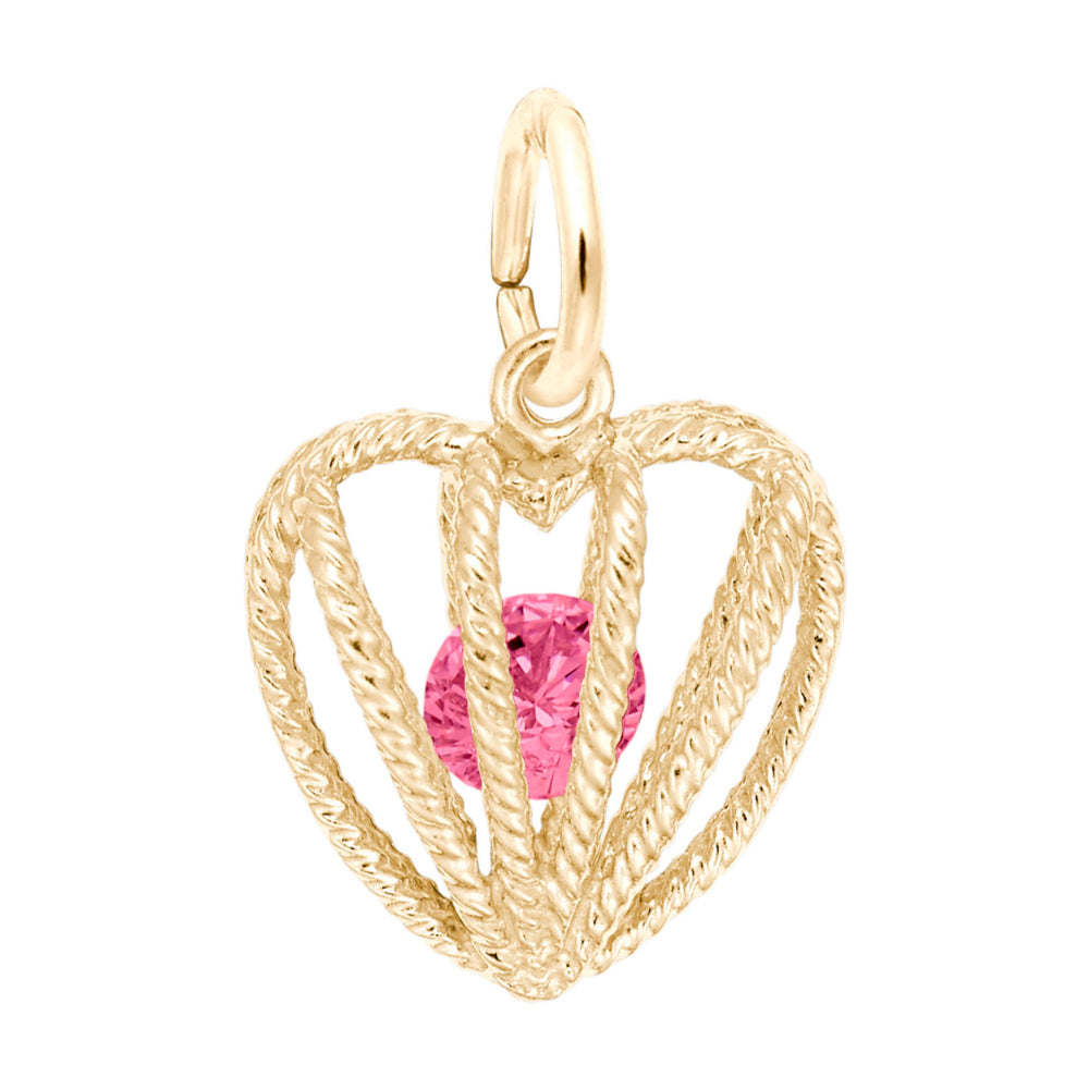 Gold heart-shaped pendant with a pink gemstone on a white background