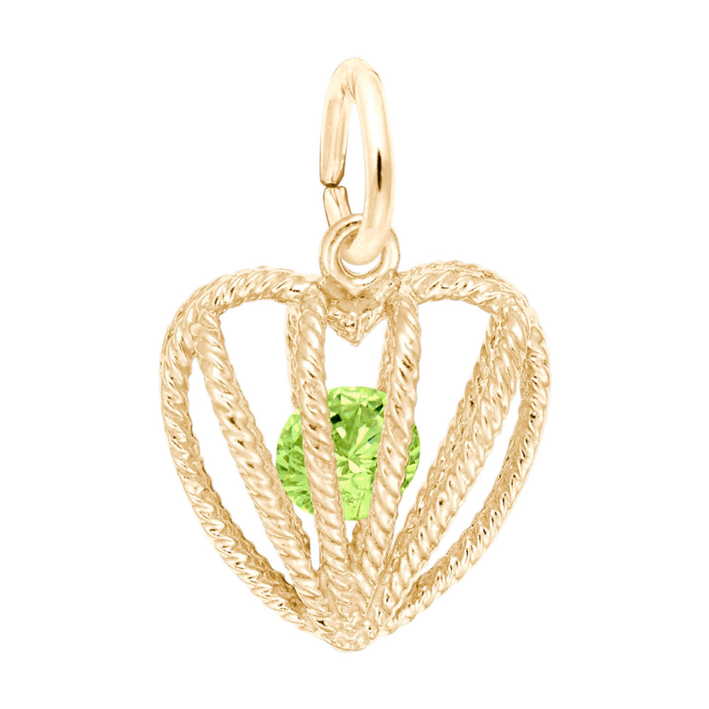 Gold heart-shaped pendant with a yellow-green gemstone on a white background