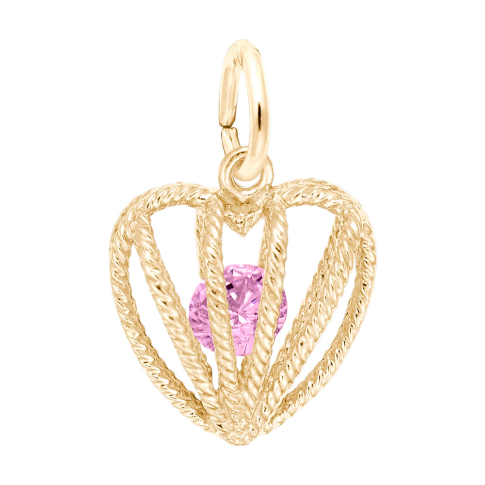 Gold heart-shaped pendant with a pink gemstone on a white background