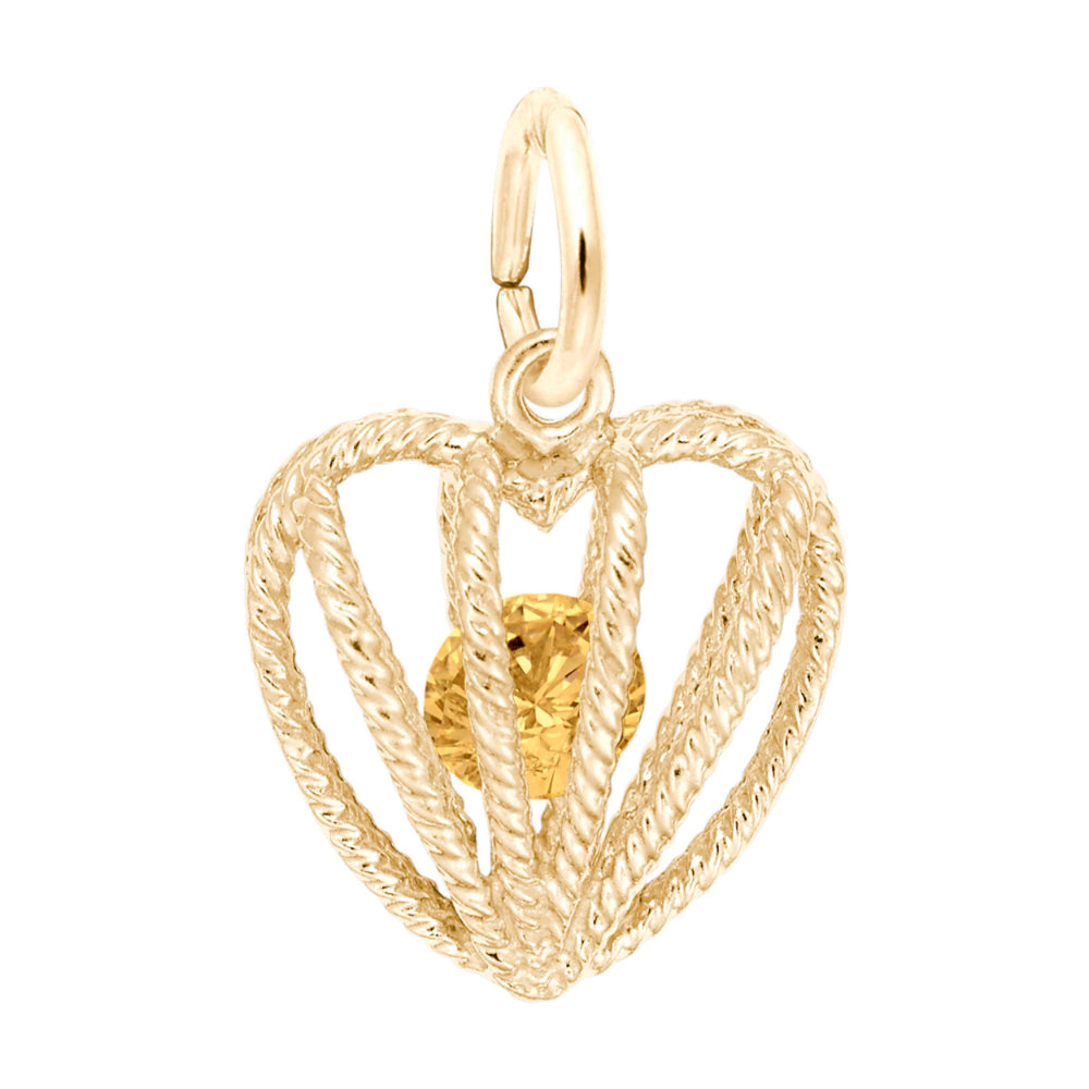 Gold heart-shaped pendant with an orange gemstone on a white background