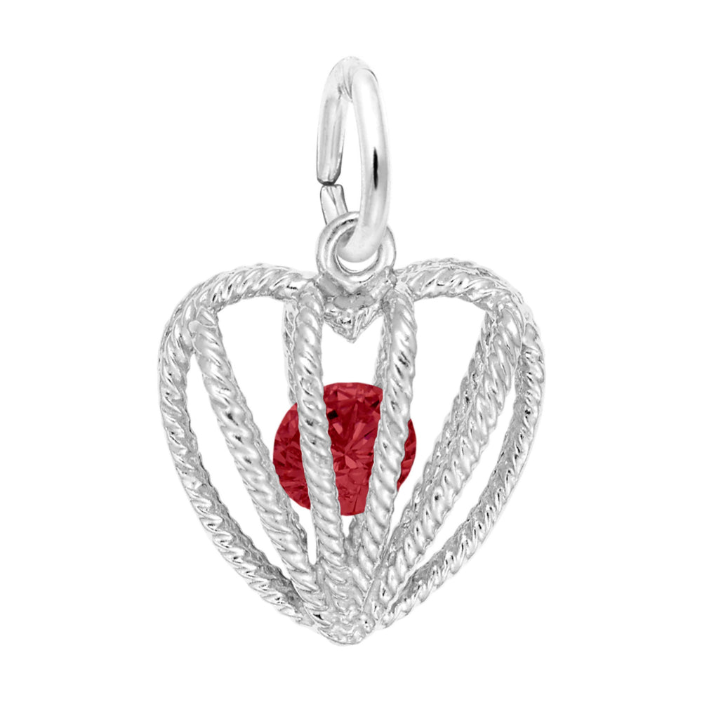 Silver heart-shaped pendant with a red gemstone on a white background