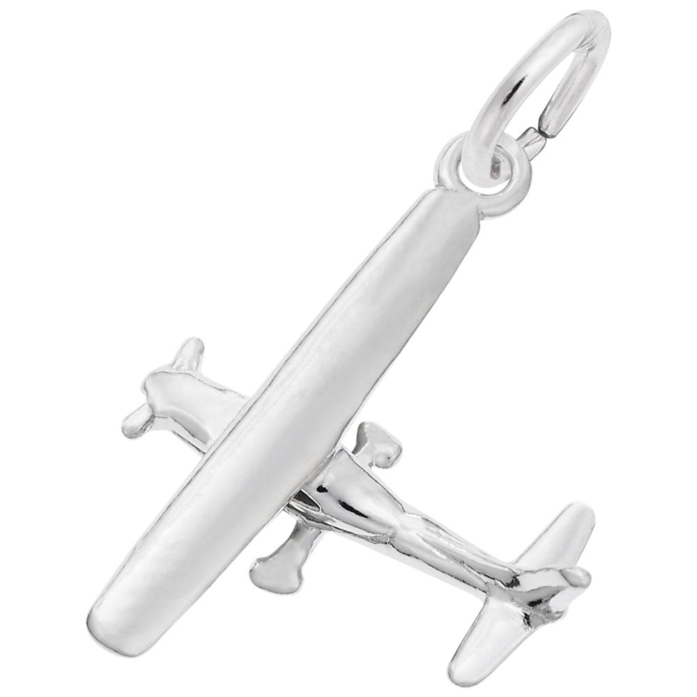 Silver airplane charm on a white background